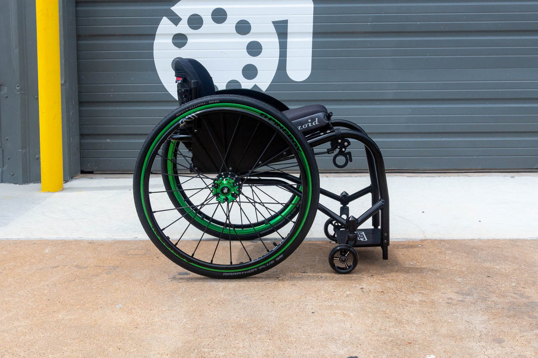 Side view of a Push Lox Wheelchair Wheel Lock system mounted to a Reckless Wheelchairs Ultra Rigid Wheelchair