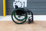 Side view of a Push Lox Wheelchair Wheel Lock system mounted to a Reckless Wheelchairs Ultra Rigid Wheelchair