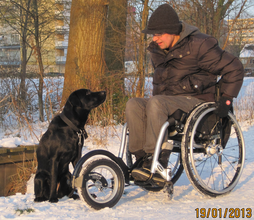 Freewheel Wheelchair Attachment user in the show with a dog