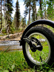 Freewheel Wheelchair Attachment in the grass off road
